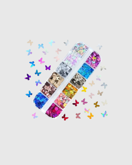 Caja con lentejuelas brillantes en forma de mariposa